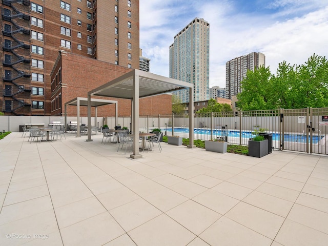 555 W Cornelia Ave Unit 1405, Chicago, IL 60657 - community pool featuring fence, a view of city, and a patio