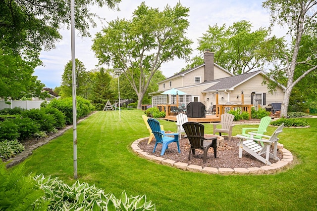 25W651 Towpath Ct, Wheaton, IL 60189 - view of grassy yard featuring a fire pit and a wooden deck