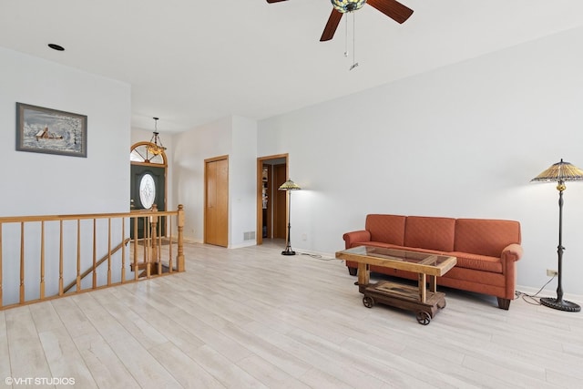 6719 W Applewood Ln, Spring Grove, IL 60081 - living area featuring an upstairs landing, light wood-type flooring, baseboards, and ceiling fan