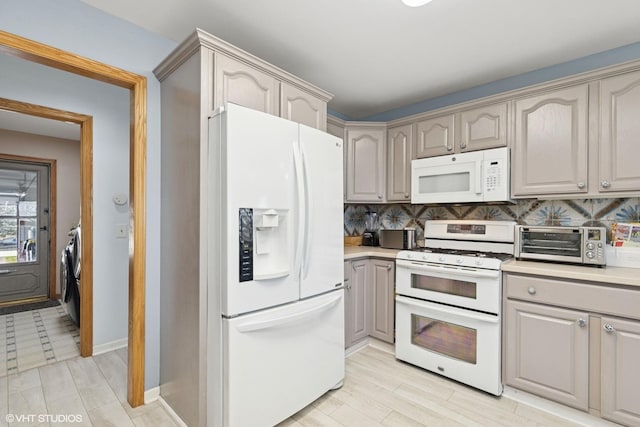 6719 W Applewood Ln, Spring Grove, IL 60081 - kitchen featuring white appliances, backsplash, light countertops, gray cabinetry, and baseboards