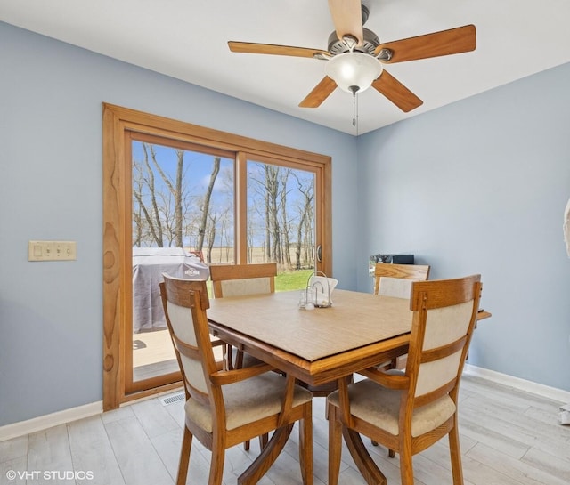 6719 W Applewood Ln, Spring Grove, IL 60081 - dining space featuring baseboards, ceiling fan, and light wood-style floors