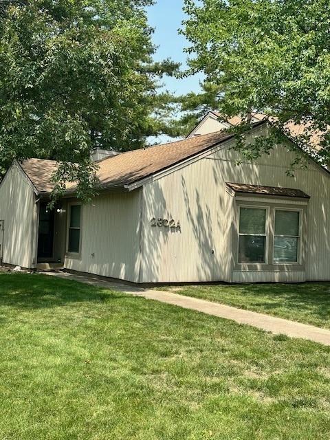 2302 Melrose Dr Unit A, Champaign, IL 61820 - view of property exterior with a lawn