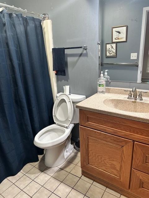 2302 Melrose Dr Unit A, Champaign, IL 61820 - bathroom with tile patterned floors, toilet, vanity, and a shower with curtain