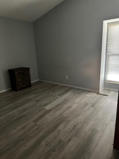 2302 Melrose Dr Unit A, Champaign, IL 61820 - spare room with wood finished floors and baseboards