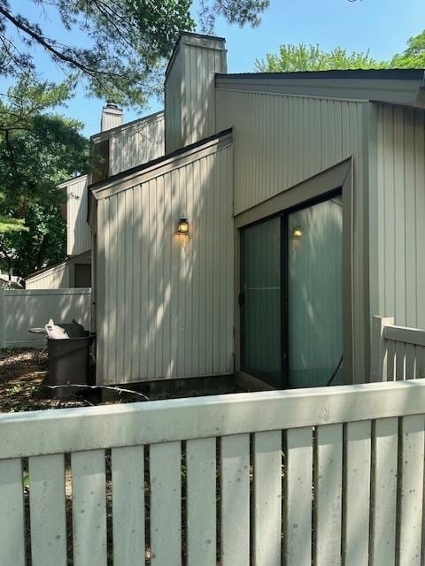 2302 Melrose Dr Unit A, Champaign, IL 61820 - view of home's exterior featuring a chimney