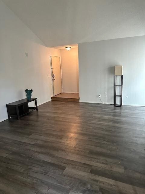 2302 Melrose Dr Unit A, Champaign, IL 61820 - spare room with dark wood-style flooring, baseboards, and lofted ceiling