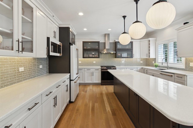 16829 Sheridans Trl, Orland Park, IL 60467 - kitchen featuring stainless steel appliances, wall chimney exhaust hood, backsplash, a sink, and recessed lighting