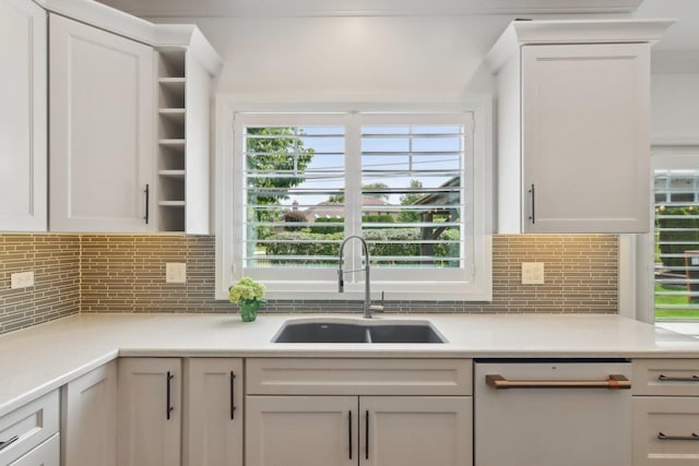 16829 Sheridans Trl, Orland Park, IL 60467 - kitchen with dishwasher, a sink, backsplash, and light countertops