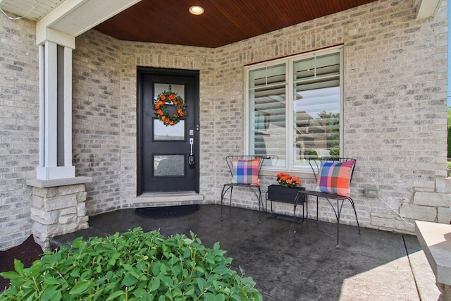 16829 Sheridans Trl, Orland Park, IL 60467 - doorway to property featuring a porch and brick siding