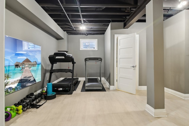 16829 Sheridans Trl, Orland Park, IL 60467 - exercise room with healthy amount of natural light, wood finished floors, and baseboards