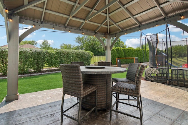 16829 Sheridans Trl, Orland Park, IL 60467 - view of patio with a gazebo, a trampoline, and outdoor dining area