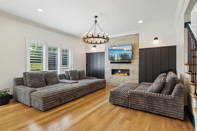 16829 Sheridans Trl, Orland Park, IL 60467 - living room featuring crown molding, a chandelier, stairway, wood finished floors, and a fireplace