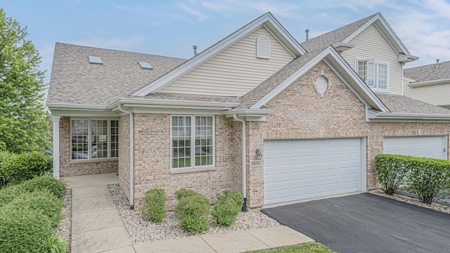 11656 Lake Shore Dr, Orland Park, IL 60467 - traditional-style house featuring roof with shingles, asphalt driveway, brick siding, and a garage