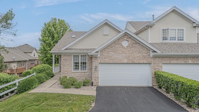 11656 Lake Shore Dr, Orland Park, IL 60467 - traditional home with driveway, roof with shingles, brick siding, a garage, and a front lawn