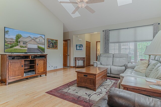 11656 Lake Shore Dr, Orland Park, IL 60467 - living area with ceiling fan, high vaulted ceiling, light wood-type flooring, and a skylight