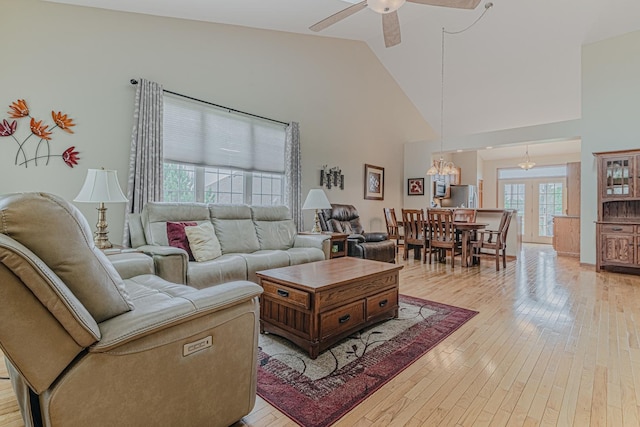 11656 Lake Shore Dr, Orland Park, IL 60467 - living area with light wood-style flooring, high vaulted ceiling, a chandelier, and ceiling fan