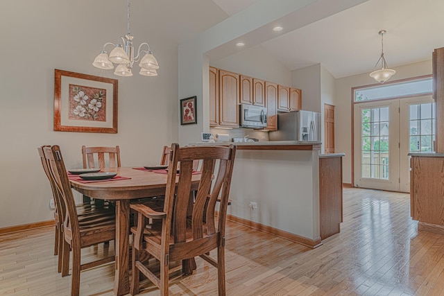 11656 Lake Shore Dr, Orland Park, IL 60467 - dining space featuring lofted ceiling, light wood-style floors, recessed lighting, and a chandelier