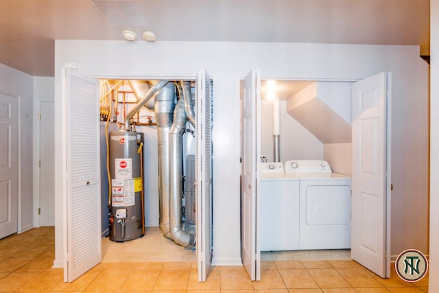 4532 S Woodlawn Ave, Chicago, IL 60653 - laundry area with water heater, independent washer and dryer, light tile patterned flooring, and baseboards