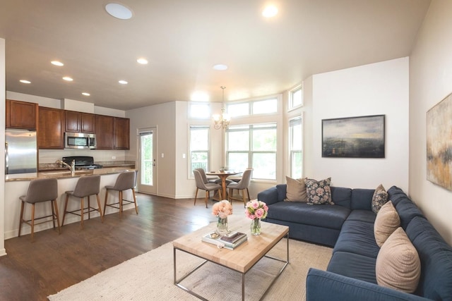 4532 S Woodlawn Ave, Chicago, IL 60653 - living room featuring a chandelier, wood finished floors, recessed lighting, and baseboards