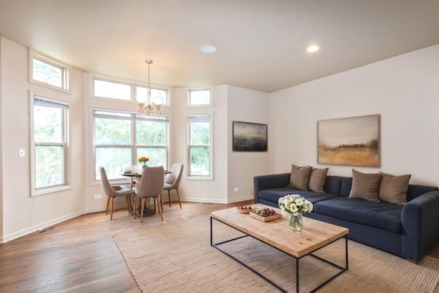 4532 S Woodlawn Ave, Chicago, IL 60653 - living room with a chandelier, plenty of natural light, wood finished floors, baseboards, and recessed lighting