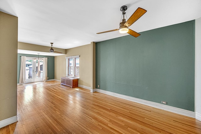 1044 S E Ave, Oak Park, IL 60304 - unfurnished living room featuring light wood-style flooring, ceiling fan, baseboards, and a chandelier