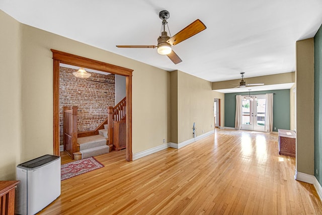1044 S E Ave, Oak Park, IL 60304 - unfurnished room featuring ceiling fan, light wood finished floors, stairway, baseboards, and brick wall