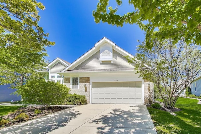 2334 Glen Eagles Ln, Riverwoods, IL 60015 - single story home with brick siding, a garage, driveway, and a front yard