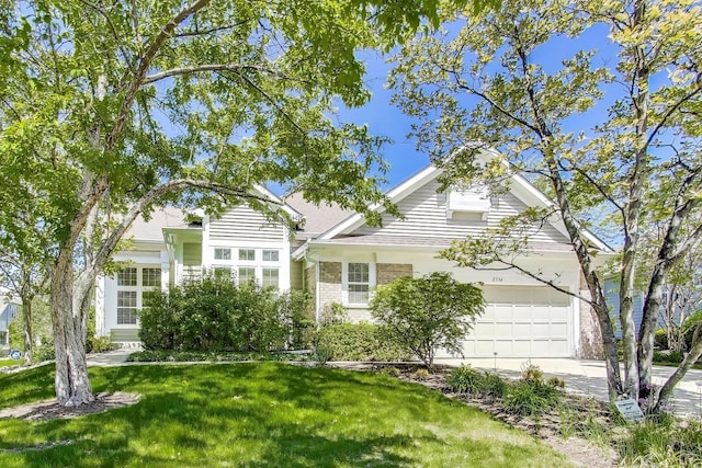 2334 Glen Eagles Ln, Riverwoods, IL 60015 - view of front of house featuring a garage, concrete driveway, a front lawn, and brick siding