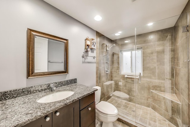 2334 Glen Eagles Ln, Riverwoods, IL 60015 - bathroom featuring toilet, a shower stall, and vanity