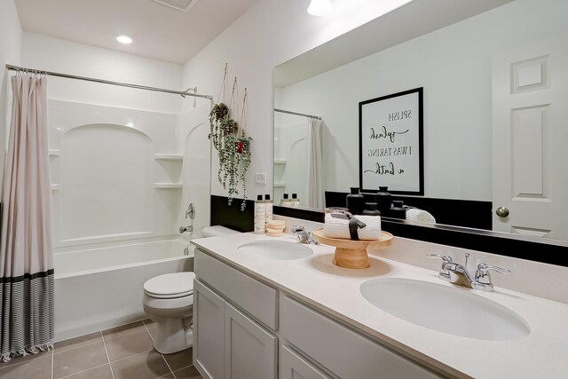 740 Cloverleaf Dr, Marengo, IL 60152 - bathroom featuring tile patterned flooring, shower / bath combo with shower curtain, toilet, and double vanity