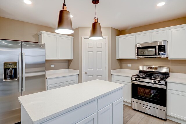 740 Cloverleaf Dr, Marengo, IL 60152 - kitchen featuring stainless steel appliances, white cabinetry, recessed lighting, a center island, and pendant lighting
