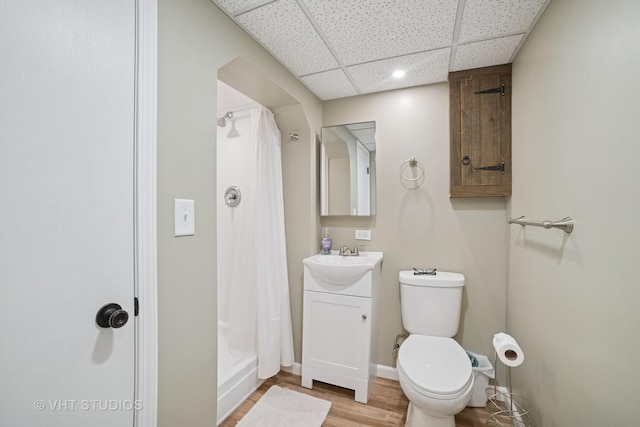 238 1st St, Cary, IL 60013 - full bathroom with a drop ceiling, toilet, vanity, curtained shower, and wood finished floors