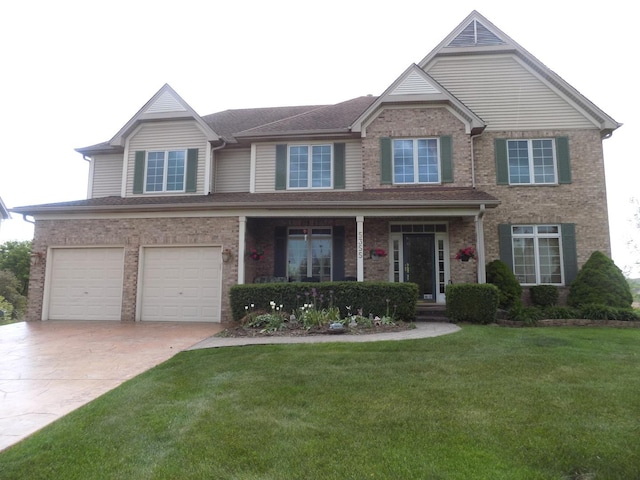 5355 Fox Path Ln, Hoffman Estates, IL 60192 - traditional-style house with driveway, brick siding, an attached garage, a front yard, and covered porch