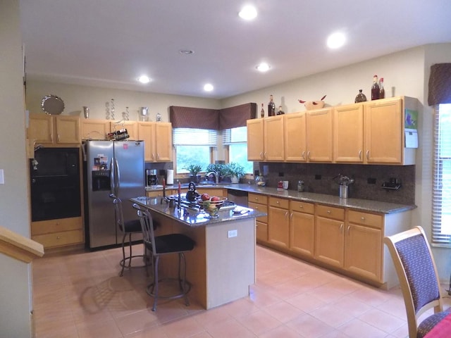 5355 Fox Path Ln, Hoffman Estates, IL 60192 - kitchen featuring stainless steel appliances, decorative backsplash, a kitchen bar, a center island, and recessed lighting
