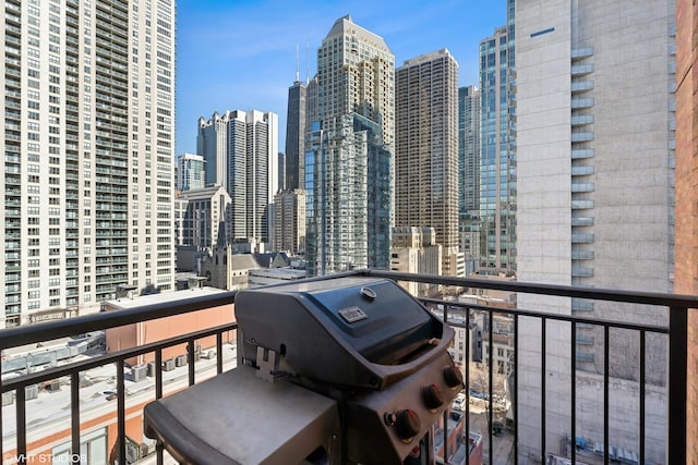 balcony featuring a grill and a view of skyline