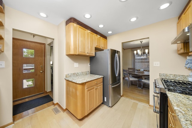 4129 N Mcvicker Ave, Chicago, IL 60634 - kitchen featuring appliances with stainless steel finishes, light wood-type flooring, a chandelier, ventilation hood, and recessed lighting