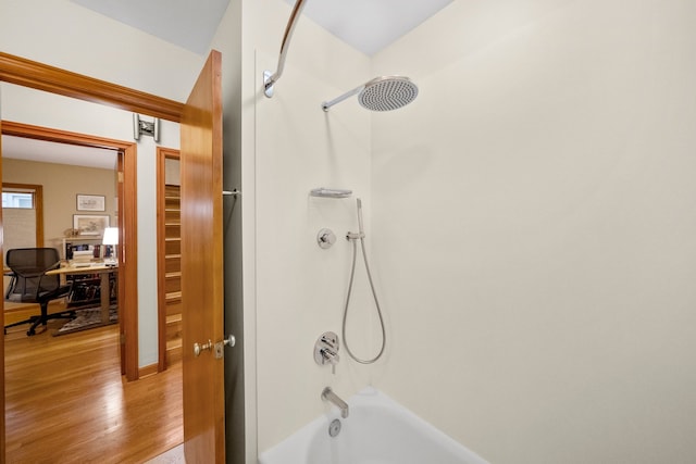4129 N Mcvicker Ave, Chicago, IL 60634 - bathroom featuring wood finished floors and shower / bathtub combination