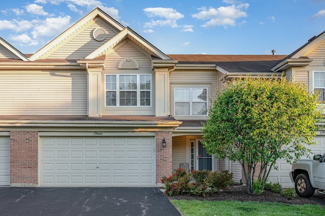 1966 Waverly Way, Montgomery, IL 60538 - townhome / multi-family property featuring brick siding, driveway, and a garage