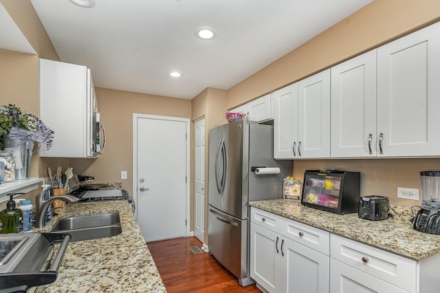 1966 Waverly Way, Montgomery, IL 60538 - kitchen featuring appliances with stainless steel finishes, white cabinets, dark wood finished floors, recessed lighting, and light stone countertops