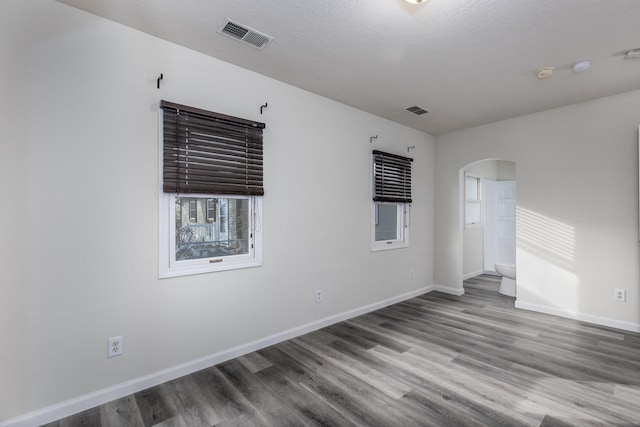 1614 Poplar St, Ottawa, IL 61350 - unfurnished room with arched walkways, wood finished floors, baseboards, and a smoke detector