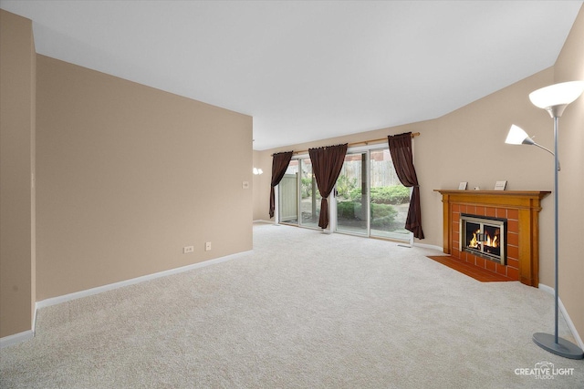 753 Candleridge Ct Unit C1, Bartlett, IL 60103 - unfurnished living room featuring carpet, a tile fireplace, and baseboards