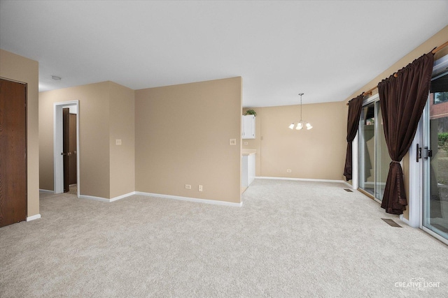 753 Candleridge Ct Unit C1, Bartlett, IL 60103 - empty room featuring a chandelier, light colored carpet, and baseboards