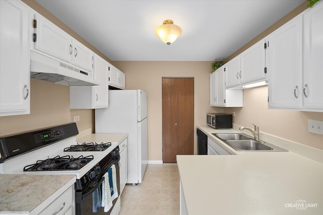 753 Candleridge Ct Unit C1, Bartlett, IL 60103 - kitchen featuring gas stove, under cabinet range hood, stainless steel microwave, a sink, and white cabinetry