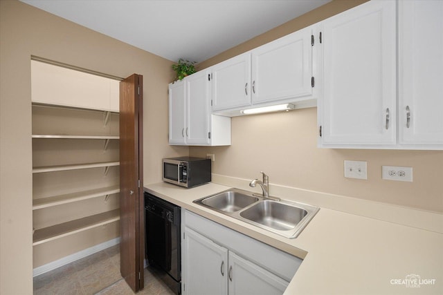 753 Candleridge Ct Unit C1, Bartlett, IL 60103 - kitchen featuring black dishwasher, stainless steel microwave, white cabinetry, a sink, and light countertops