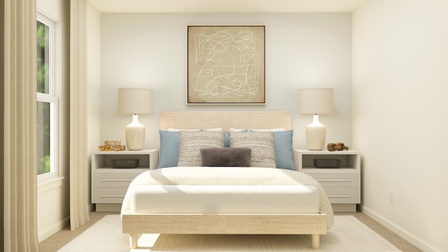 carpeted bedroom with baseboards