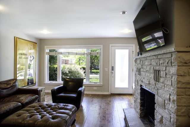 1703 Beverly Pl, Highland Park, IL 60035 - living room with a fireplace, wood-type flooring, and baseboards