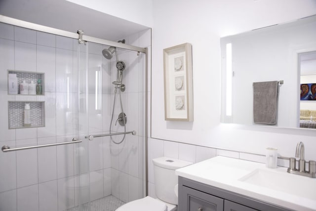 1703 Beverly Pl, Highland Park, IL 60035 - full bath with vanity, toilet, a stall shower, and tile walls
