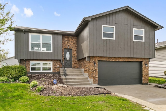 1222 Harvest Ln, University Park, IL 60484 - raised ranch with brick siding, an attached garage, driveway, and a front lawn