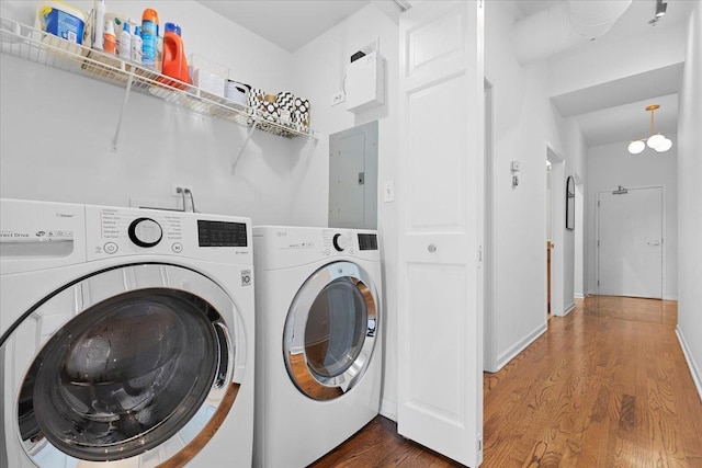1201 W Wrightwood Ave Unit 13, Chicago, IL 60614 - laundry room featuring electric panel, washing machine and clothes dryer, and wood finished floors