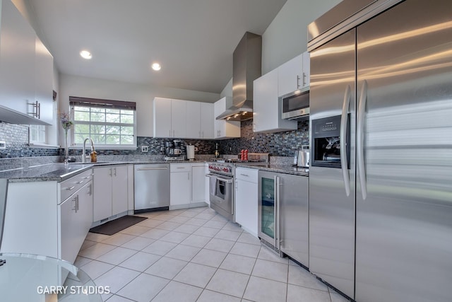 926 Willow St, Itasca, IL 60143 - kitchen featuring appliances with stainless steel finishes, wall chimney range hood, a sink, light tile patterned flooring, and beverage cooler